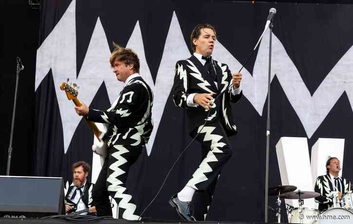 Watch The Hives join band covering them in the street outside Liverpool signing session
