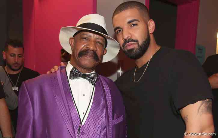 Drake pranked by his dad as a giant pink bra is thrown on stage