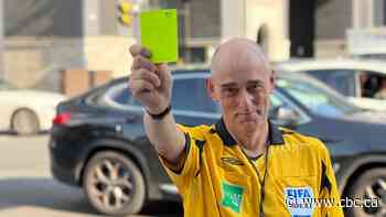 Blocking traffic? Watch out for this Toronto crosswalk referee or you might get a yellow card