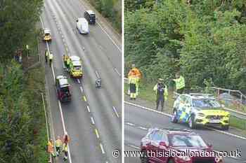 M25 J23-J24 - Traffic jam after car crashes off motorway