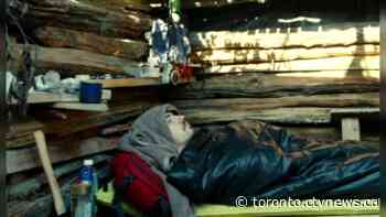 Why is a Toronto filmmaker living in a dirt pit for a month?