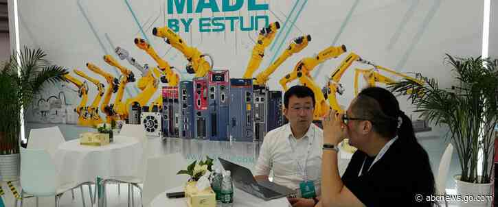 AP PHOTOS: Lifelike robots and android dogs wow visitors at Beijing robotics fair