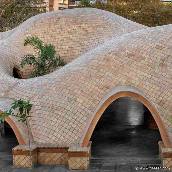 Flowing vaulted roofs top Tarang arts space by The Grid Architects