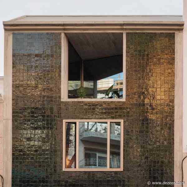Bak Gordon inserts green-tiled concrete house on sloping street in Lisbon