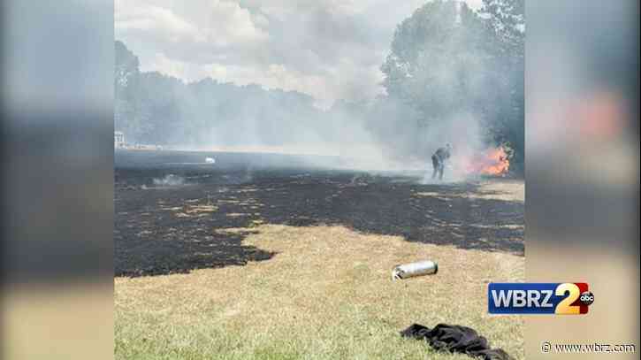 Video shows crews battling huge grass fire outside Zachary home
