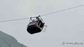Pakistani rescuers free 2 children in cable car dangling hundreds of metres in the air