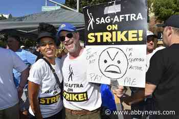 Screen politicos shout for solidarity with Hollywood strikers outside Disney