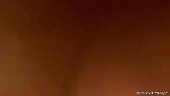 Video captures ‘incredibly rare’ B.C. wildfire tornado over lake