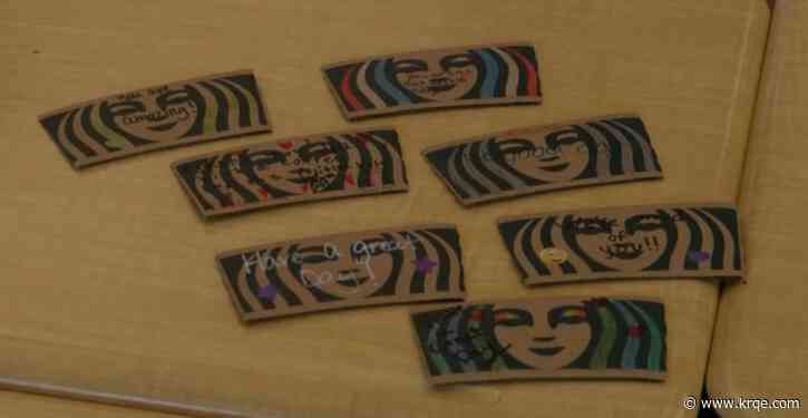 Rio Rancho elementary students decorate coffee sleeves with inspirational messages