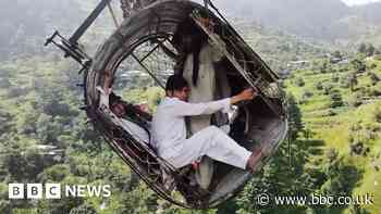 Pakistan cable car: Drone shows people trapped above ravine