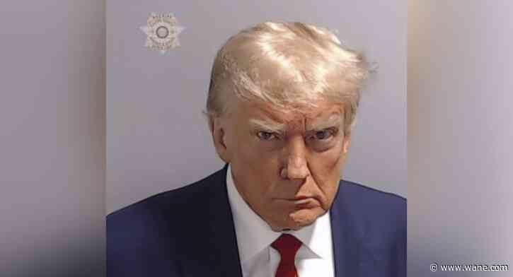 Donald Trump mug shot shows former president scowling at Atlanta booking