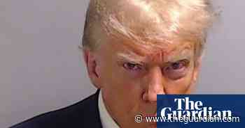 Belligerence and hostility: Trump’s mugshot defines modern US politics