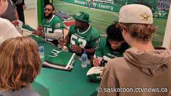 Three players signing autographs at Midtown Plaza's Rider store, Gainer to maker appearance