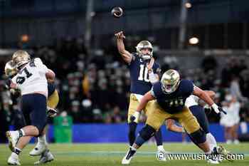 Hartman Throws 4 TD Passes as No. 13 Notre Dame Opens With a 42-3 Win Over Navy in Ireland