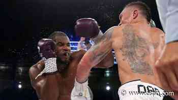 Usyk survives scare, KO's Dubois to retain titles