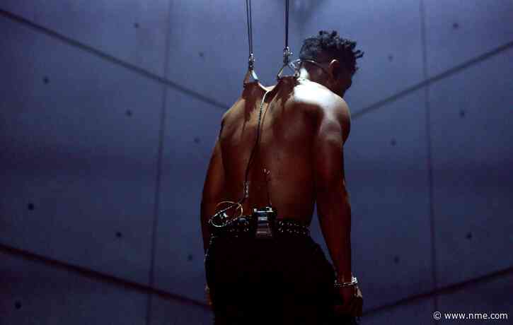 Watch Miguel perform while suspended from hooks pierced in his skin