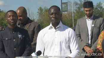 Church housing refugees in repurposed buses calls for government support