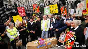 ULEZ protesters scuffle with police as tension boils over on first day of expansion of Sadiq Khan's hated £12.50 daily levy after 'blade runner' vandals destroyed cameras and TfL website crashed