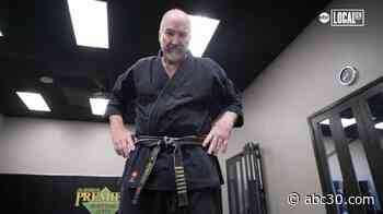 Man fighting cancer earns 8th degree black belt