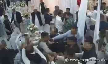 Watch 'Wild West' mass brawl at wedding as men wield chairs and poles in angry ruckus