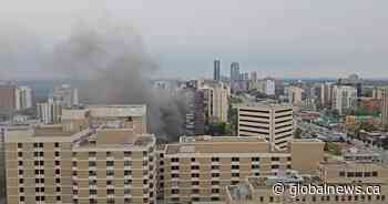 Explosion, vehicle fire sends black plume of smoke into air over downtown Edmonton