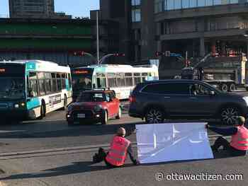 Four climate activists charged following traffic blockade at Portage Bridge