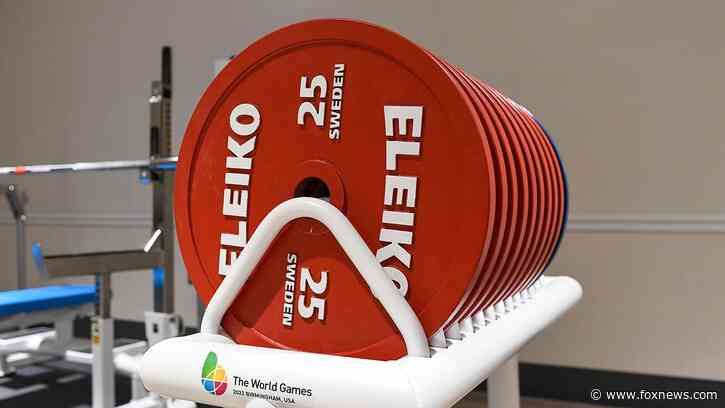 Iranian weightlifter banned for life after shaking hands with Israeli opponent