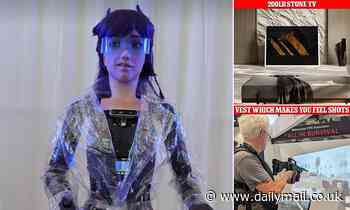 Daily Mail at IFA tech conference in Berlin: Robot that thinks 'replacing humanity will be fun', a video game vest that imitates feeling of being shot and a suitcase TV