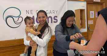 Financial crunch hits home: Northeast Calgary parents flock to back-to-school giveaway