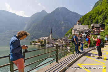 In a fairy-tale Austrian town, residents protest daily swarm of selfie-seeking tourists