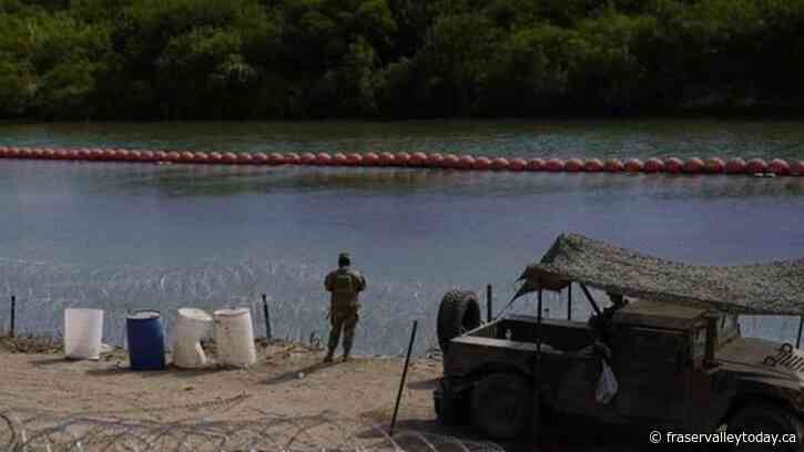 A judge orders Texas to move a floating barrier used to deter migrants to the bank of the Rio Grande