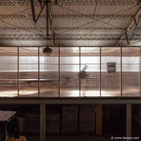 Atelier Industrial installs minimalist office within warehouse in Argentina