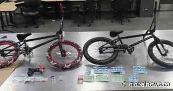 Calgary police arrest 2, seize drugs, weapons, cash