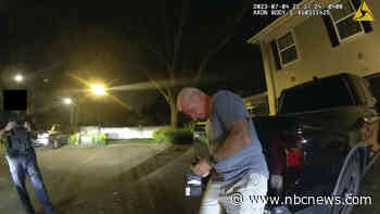 Bodycam video shows federal drug prosecutor handing police business card in DUI crash arrest