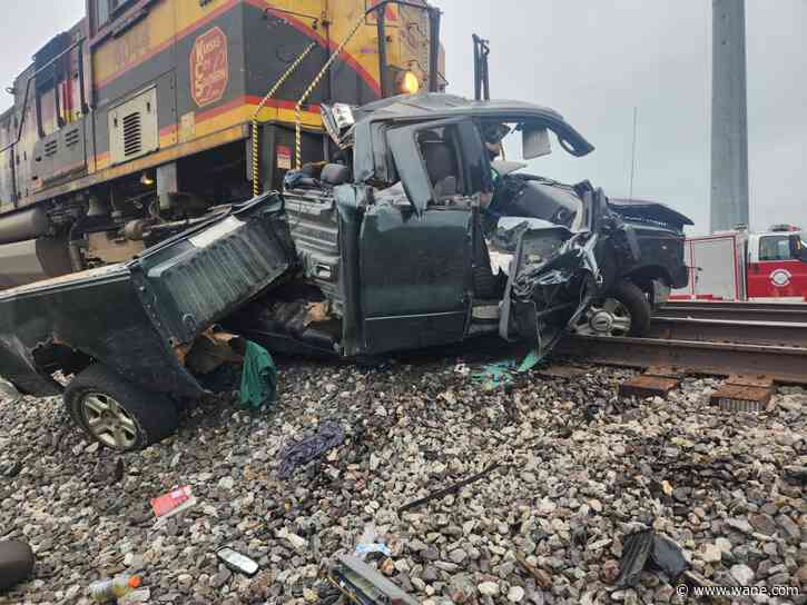 1 dead after vehicle crashes with train