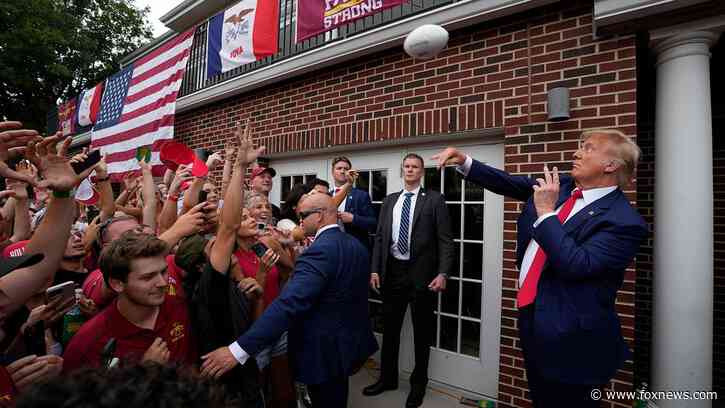 Donald Trump tailgates before Iowa-Iowa State game, crowd goes crazy as he walks into stadium