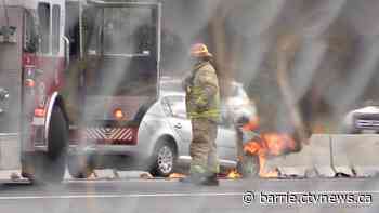 Fire crews tend to vehicle fire on Highway 400 through Barrie