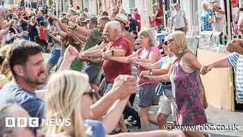 Dorchester: Hundreds dance Hokey Cokey on closed street