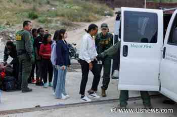 US Processes Migrants Waiting Between California Border Barriers