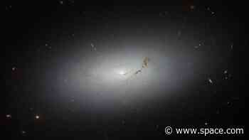 Hubble telescope spots glowing galactic disk floating in deep space (photo)