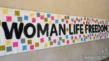 CMHR marks anniversary of Mahsa Amini's death in Iranian custody with display of Woman, Life, Freedom banner