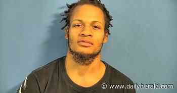 Man charged with robbing Addison Verizon store; two other suspects at large