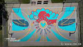 Artist scores points in the paint with mural on Winnipeg basketball court