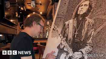 Black Sabbath's Tony Iommi recreated by ink stamp artist