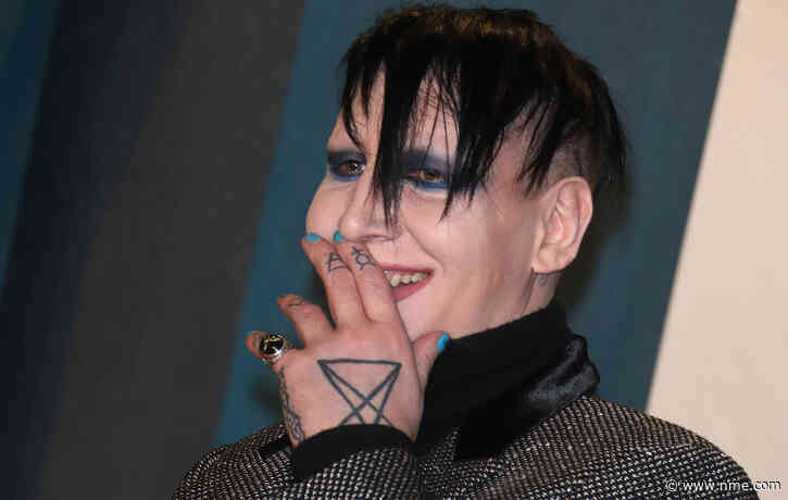 Marilyn Manson fined for blowing his nose and spitting at videographer