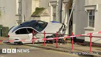 BMW hits Daventry house after near miss with pedestrians
