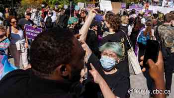 Arrests, heated exchanges mark rallies for and against teaching LGBTQ rights in schools