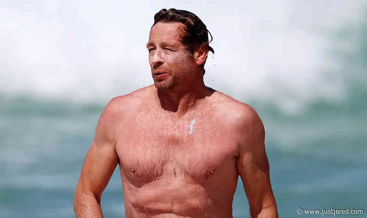 Simon Baker Hits the Beach for Shirtless Beach Day with Son Claude
