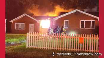 Crews work to control Portsmouth house fire late Friday night