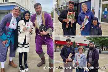 Muslim volunteers hand out roses to shoppers in Blackburn